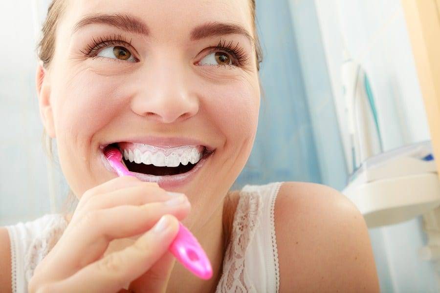 Happy Girl Brushing Teeth