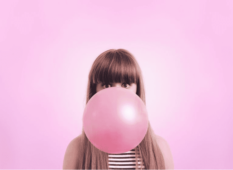 Girl Blowing Big Gum Bubble
