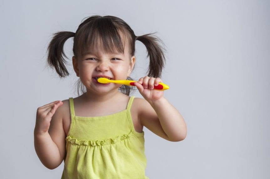 Cute Asian Baby Brushing Teeth